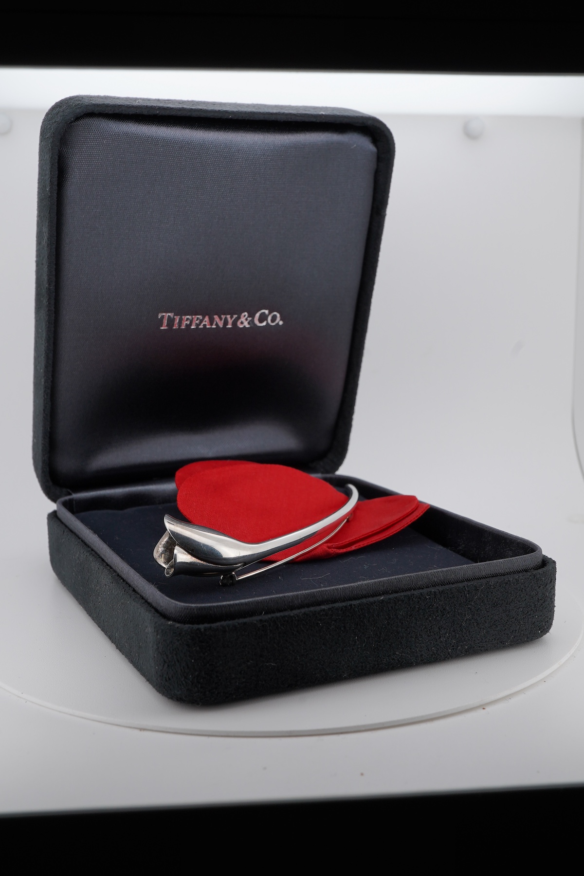 A recent Elsa Peretti for Tiffany & Co 925 posy holder brooch, signed, 86mm, with Tiffany & Co box and similar outer box.
